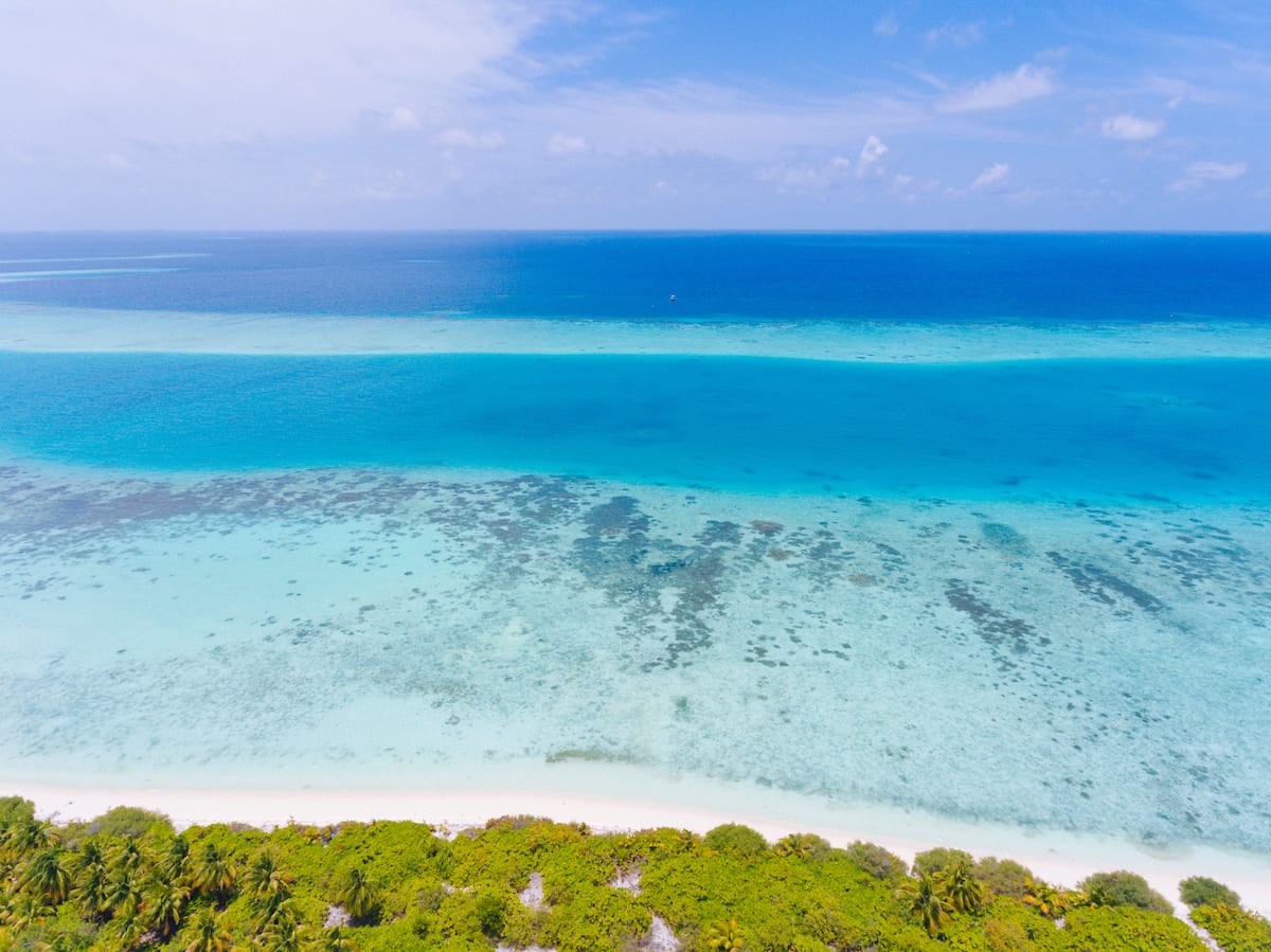 Aerial of Kandima Maldives' three-kilometre island in Dhaalu Atoll