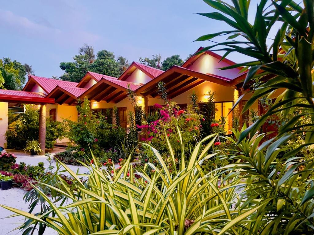 Thoddoo Beach Holiday Inn courtyard among coconut palms