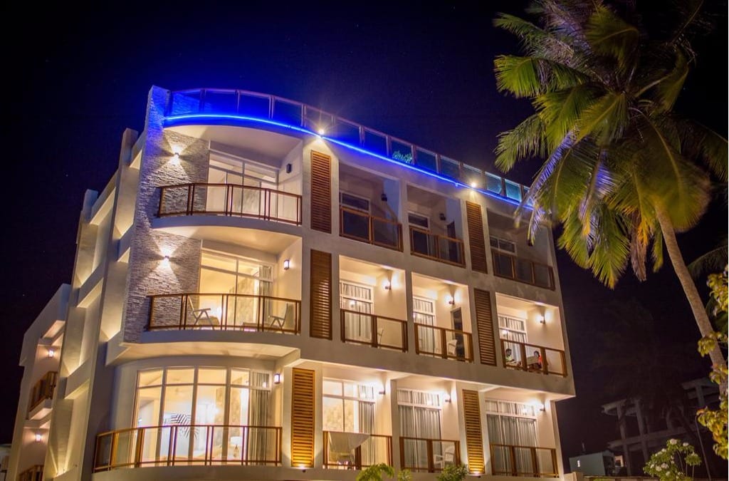 Velana Beach Hotel exterior with palm garden, Maafushi